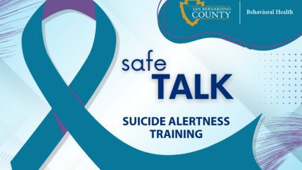 A promotional graphic featuring a large teal and purple awareness ribbon on a light blue geometric background. The text reads “safeTALK Suicide Alertness Training.” The San Bernardino County Behavioral Health logo appears in the upper right corner within a teal and purple curved banner. Decorative abstract brush and dot patterns accent the corners of the design.