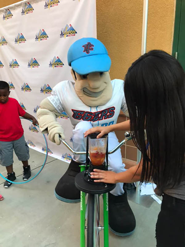 Mascot powering blender with bicycle