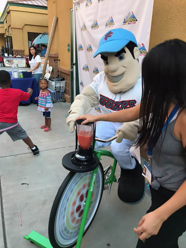 Mascot powering blender with bicycle